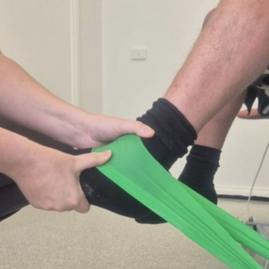 Ankle strengthening exercise with resistance band during rehabilitation